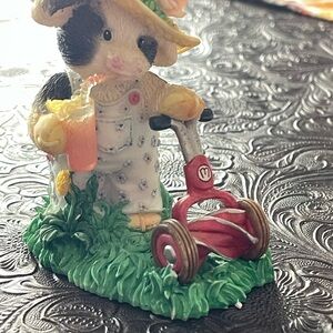 Mary’s moo moo, Mooing the lawn.  Charming Figurine with Red and Green Accents